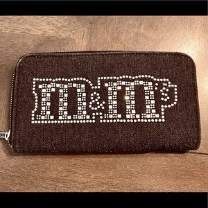 M&M rhinestone logo black clutch bag.